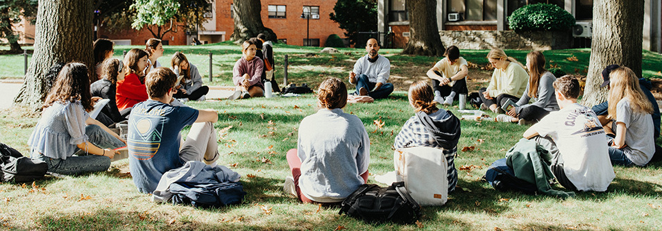 Longo and students on lawn